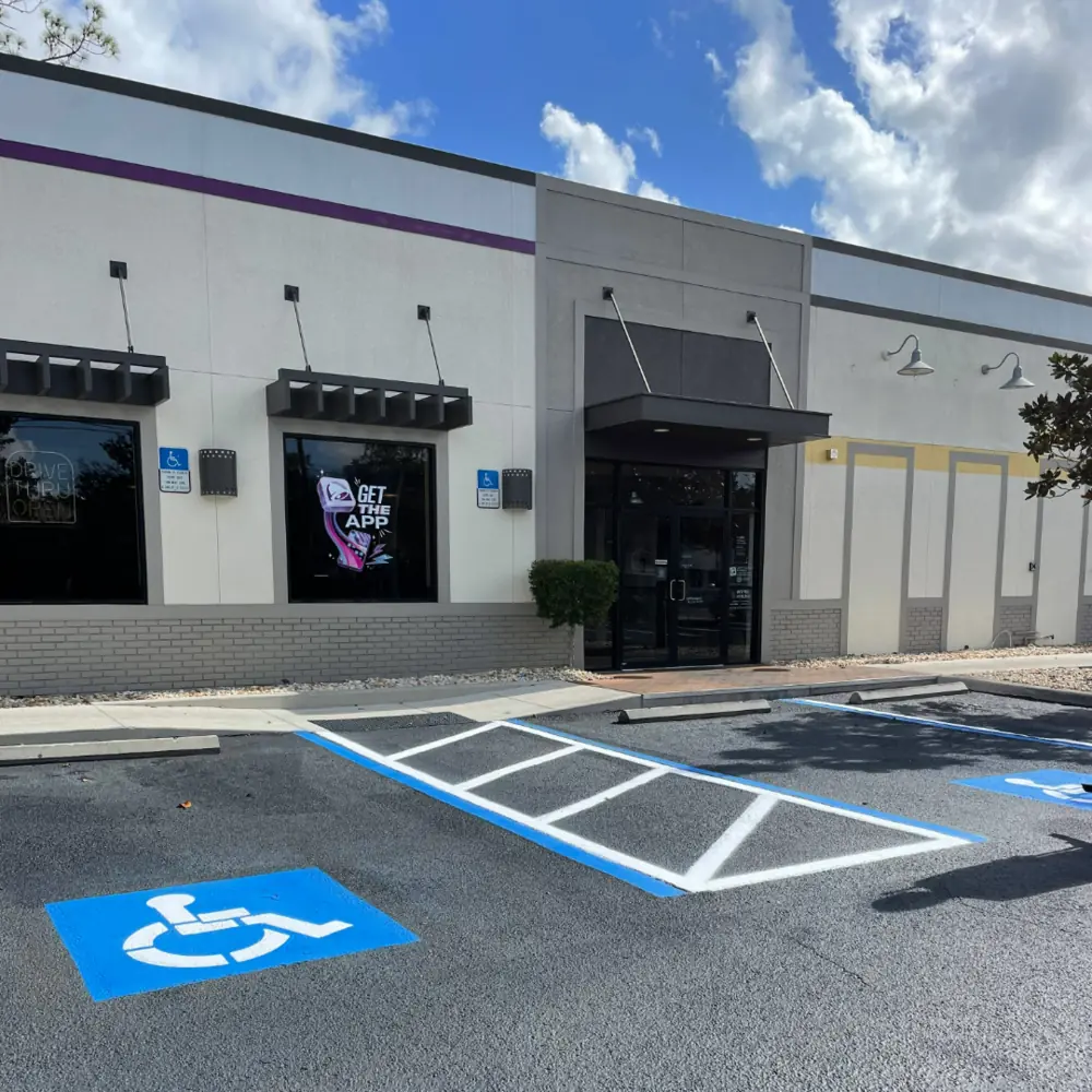 Freshly striped Taco Bell parking lot with ADA accessible stalls in Fort Myers Florida